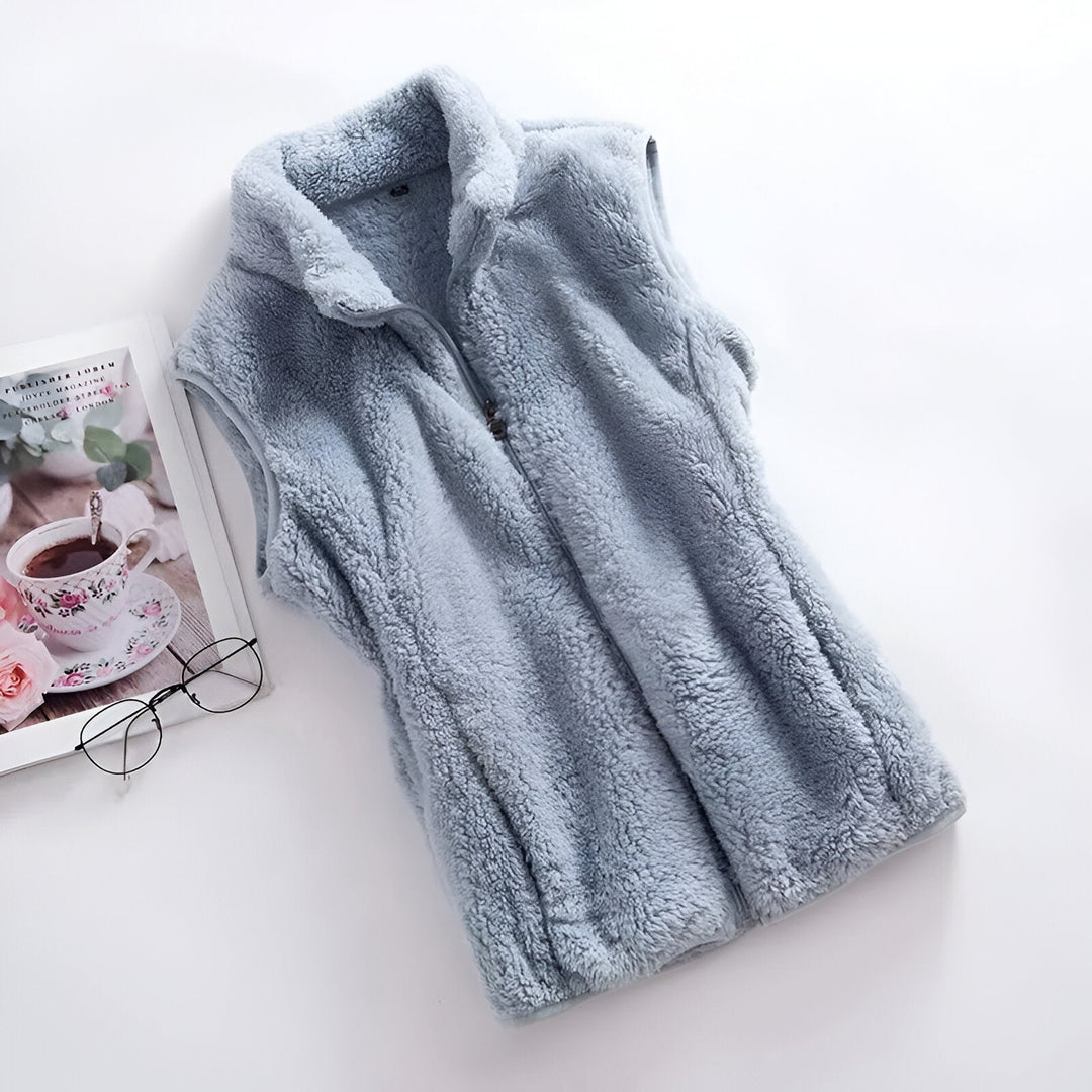 Marisela fleece vests folded and stacked in various colors