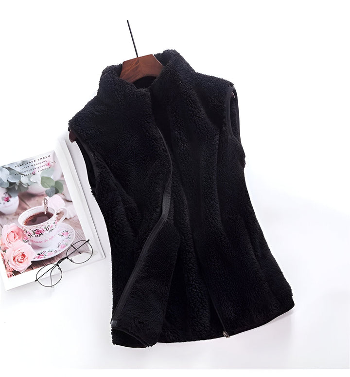 Marisela fleece vests folded and stacked in various colors