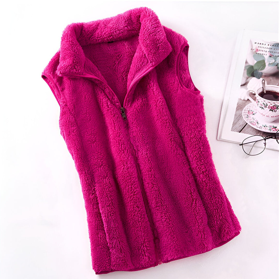 Marisela fleece vests folded and stacked in various colors
