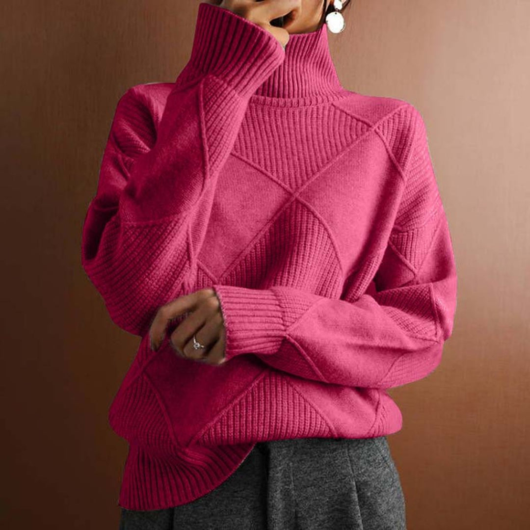 Marisol oversized diamond pattern sweater laid flat with jeans