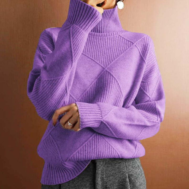 Marisol oversized diamond pattern sweater laid flat with jeans