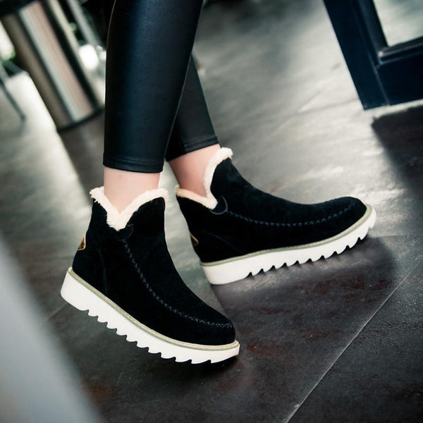 Marisol fur-trim ankle boots in black, side view on model