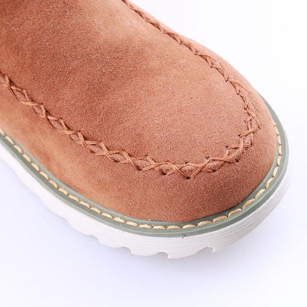 Marisol fur-trim ankle boots, close-up on stitched toe detail