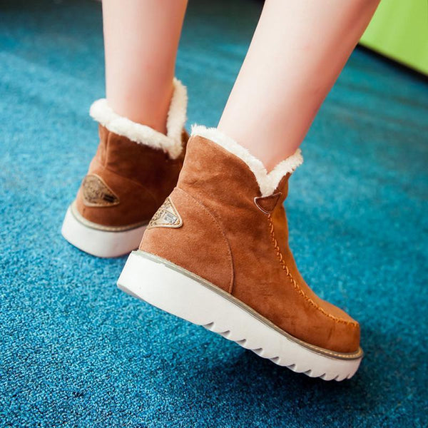 Marisol fur-trim ankle boots in brown, walking side view