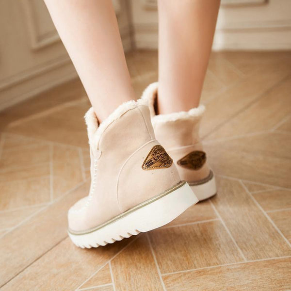 Marisol fur-trim ankle boots in light pink, back view on model