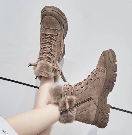 Marisol brown fur trim lace-up platform snow boots, side view on model