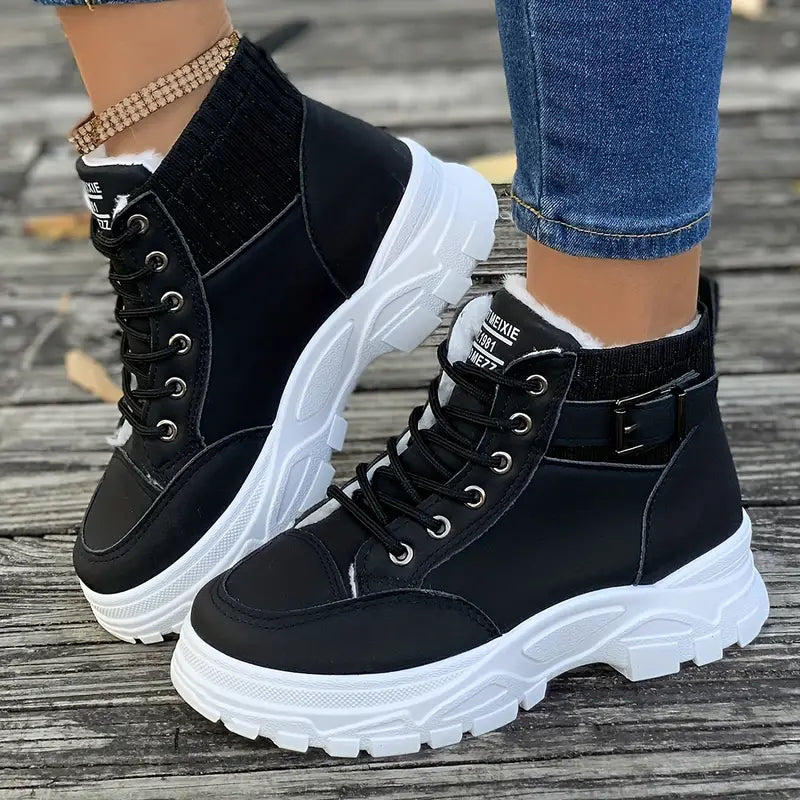 Marissa black lace-up high-top sneaker boots worn with jeans, side view
