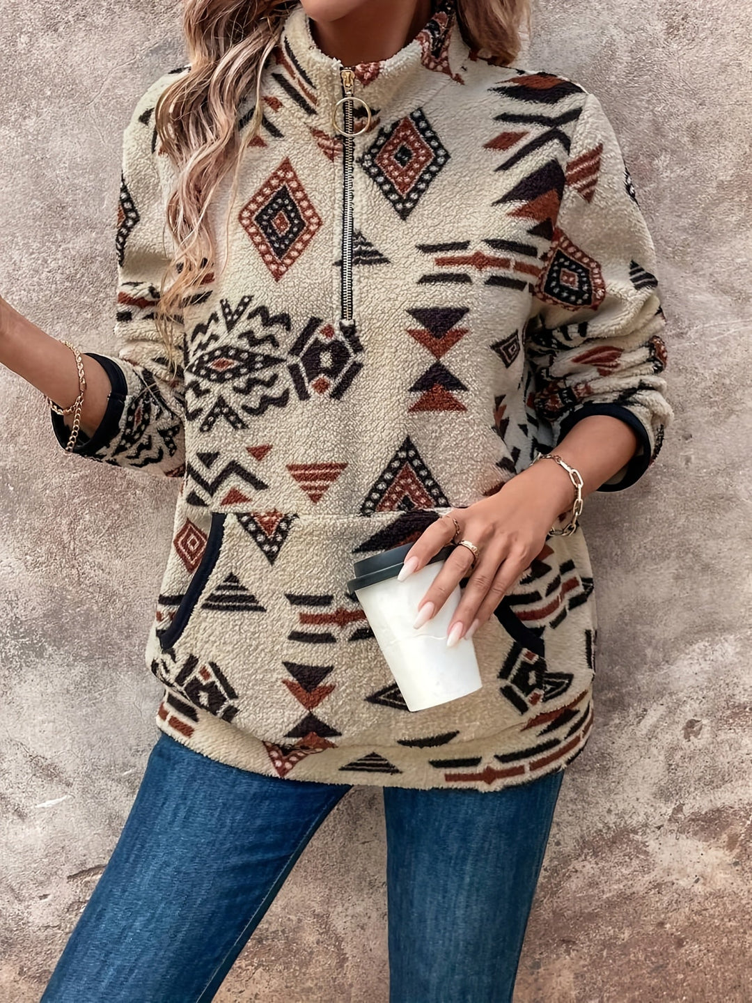 Marlowe Aztec print quarter-zip pullover, close-up of zipper and cuff