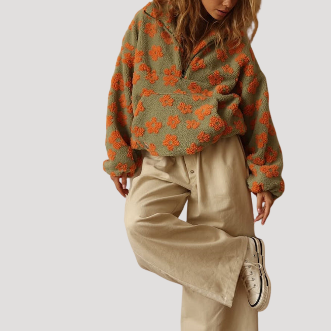 Marlowe floral half-zip sweater in orange floral print, styled with wide-leg pants