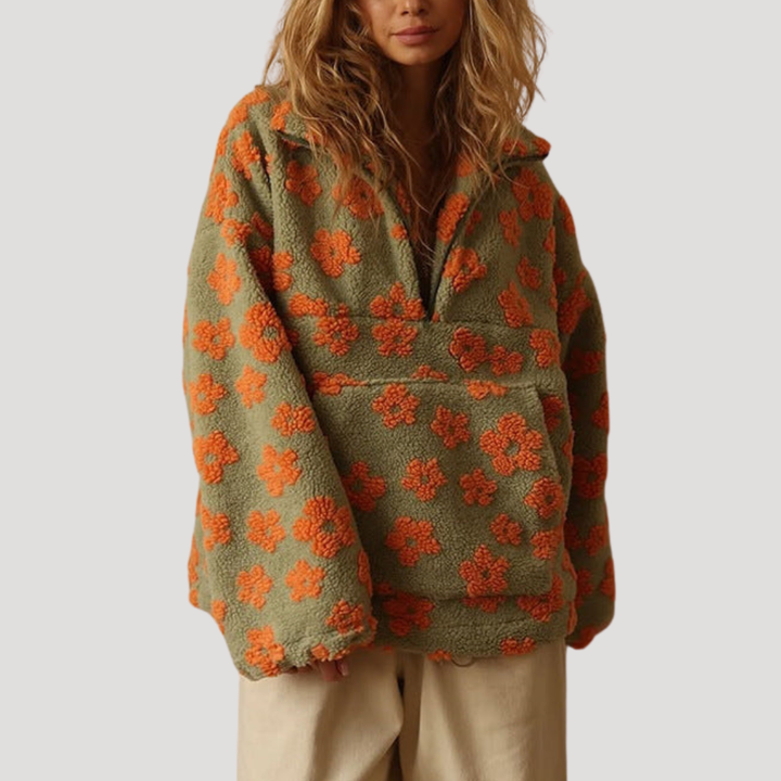 Marlowe floral half-zip sweater in orange floral print, styled with wide-leg pants