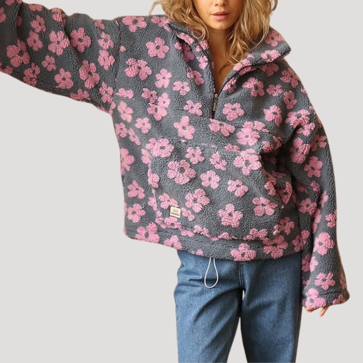Marlowe floral half-zip sweater in orange floral print, styled with wide-leg pants