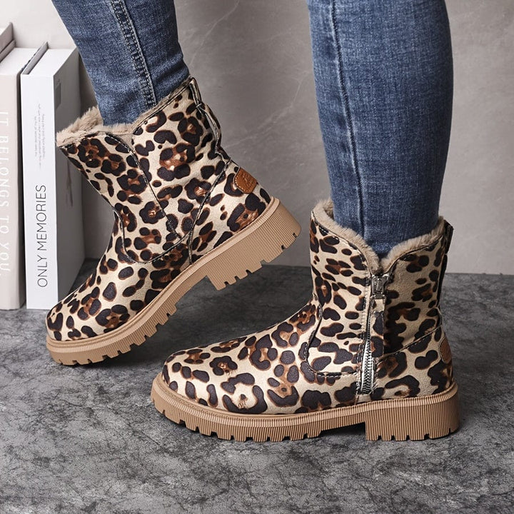 Marlowe fur lined ankle boots in leopard print, side view on model