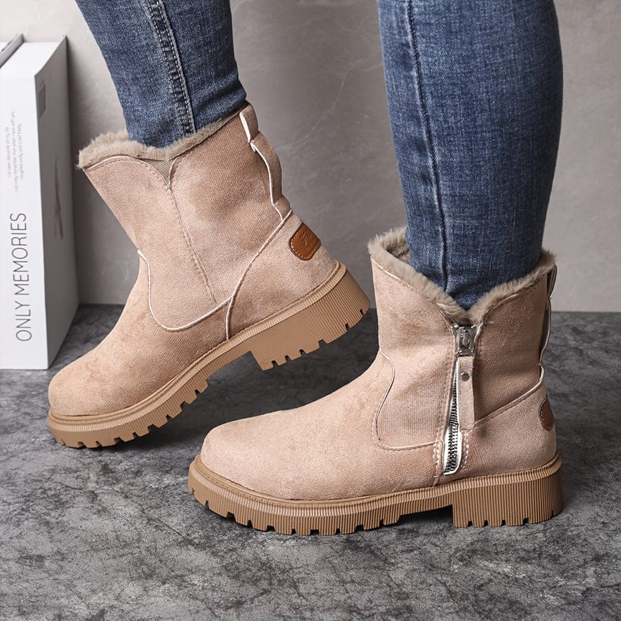 Marlowe fur lined ankle boots in beige, side view on model