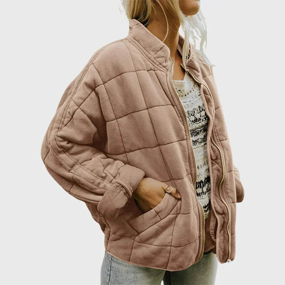 Marlowe quilted zip-up bomber jacket in pink, front side view with hand in pocket