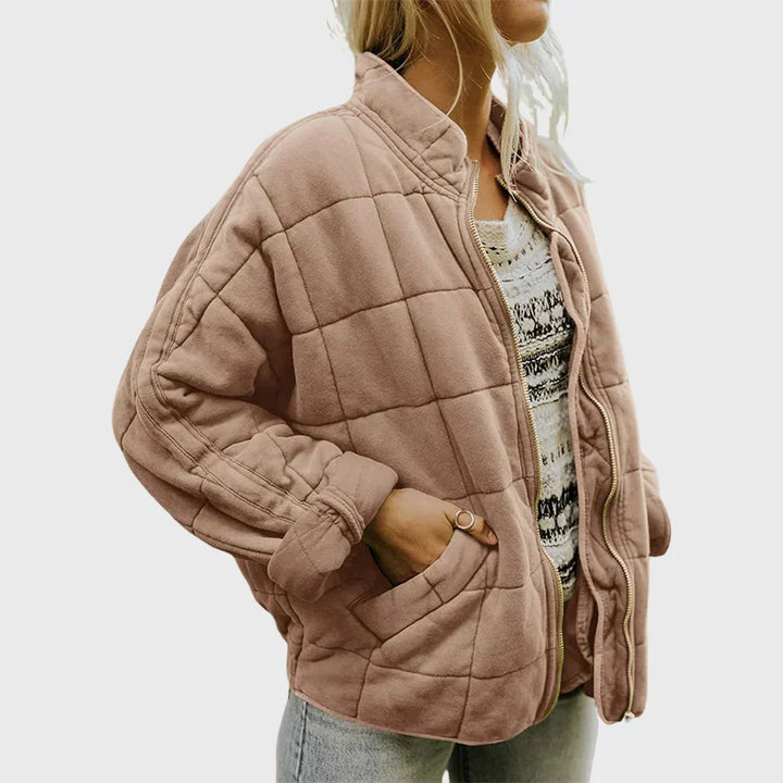 Marlowe quilted zip-up bomber jacket in pink, front side view with hand in pocket