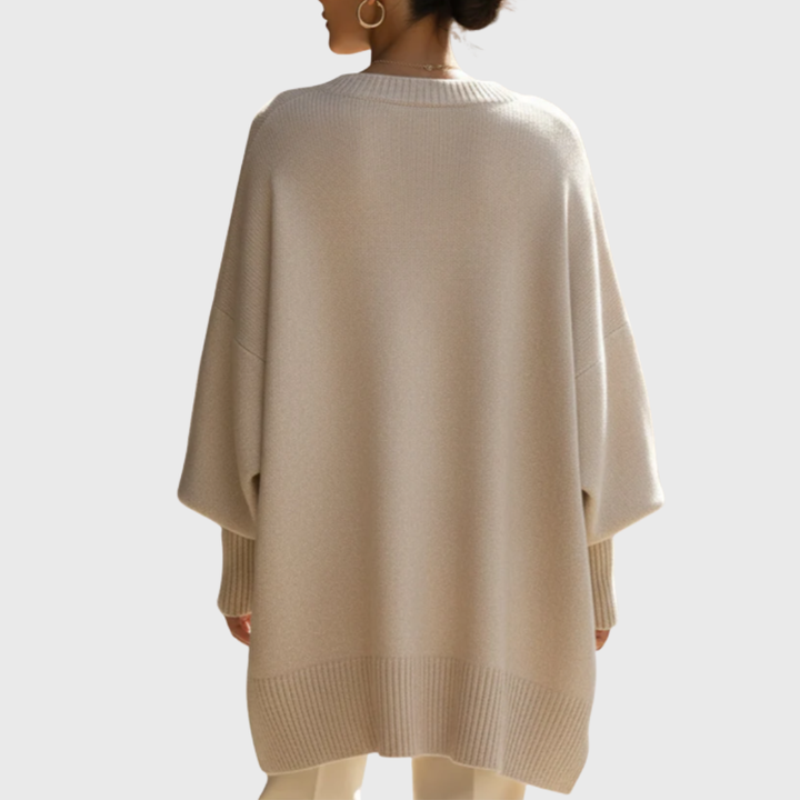 Meredith oversized beige poncho sweater with asymmetric hem, back view