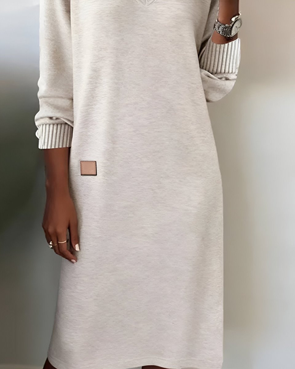 Mia oatmeal midi dress close-up showing leather patch hem detail