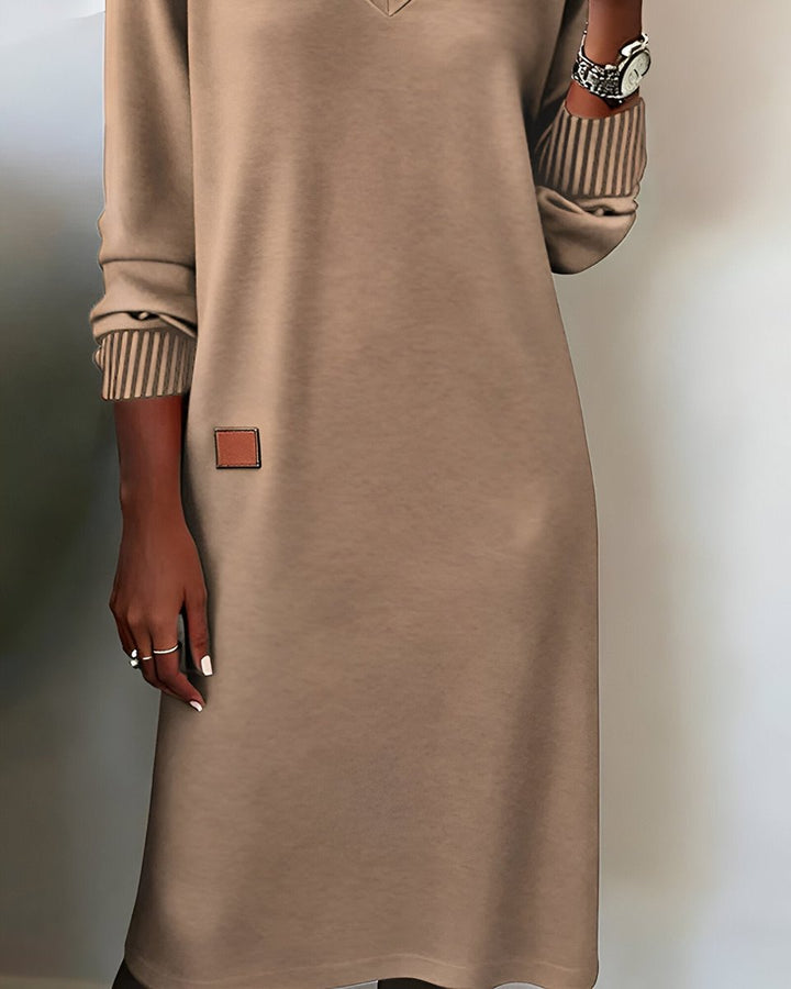 Mia taupe midi dress close-up showing leather patch hem detail