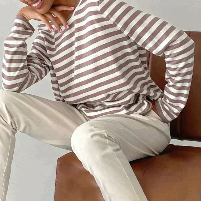 Nadia taupe striped sweatshirt styled seated, side view