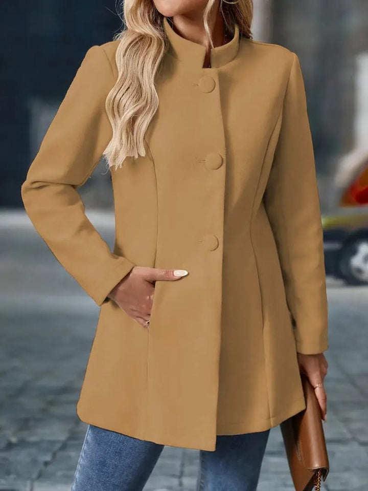Naomi black longline blazer coat, front view with hand in pocket