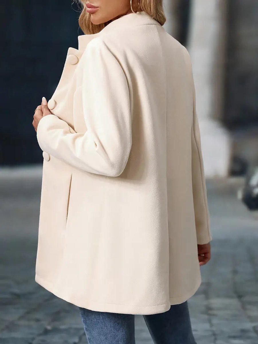 Naomi cream longline blazer coat, close-up front view with hand in pocket