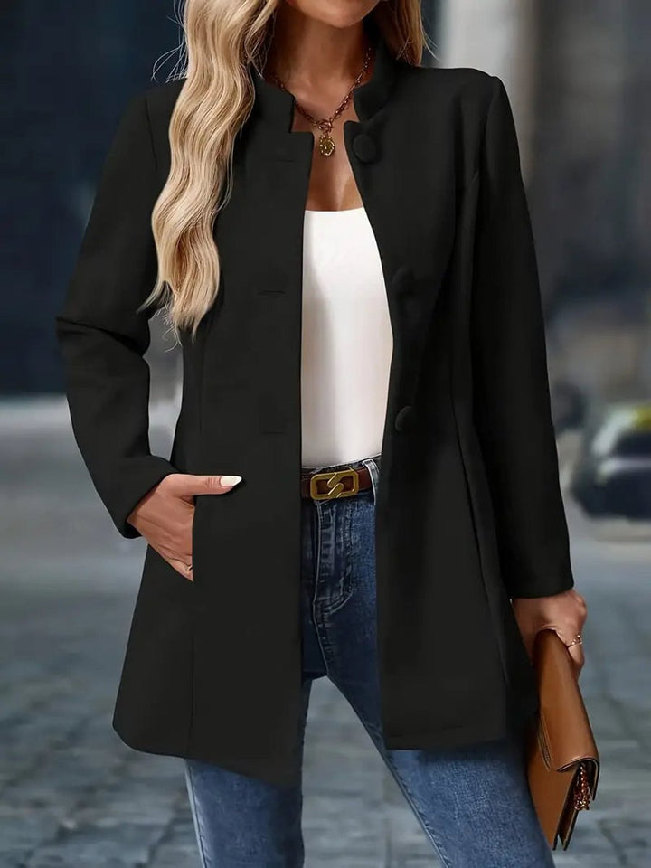 Naomi black stand collar longline blazer coat, front view with hand in pocket