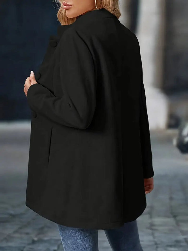 Naomi black longline blazer coat, close-up front view of stand collar and buttons