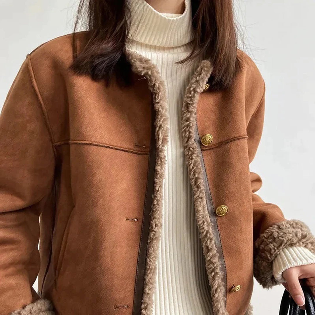 Odette shearling coat collarless design with gold buttons, close-up front view