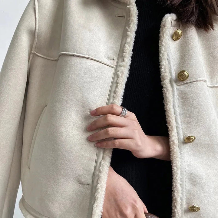 Odette shearling coat in cream, close-up front view with buttons