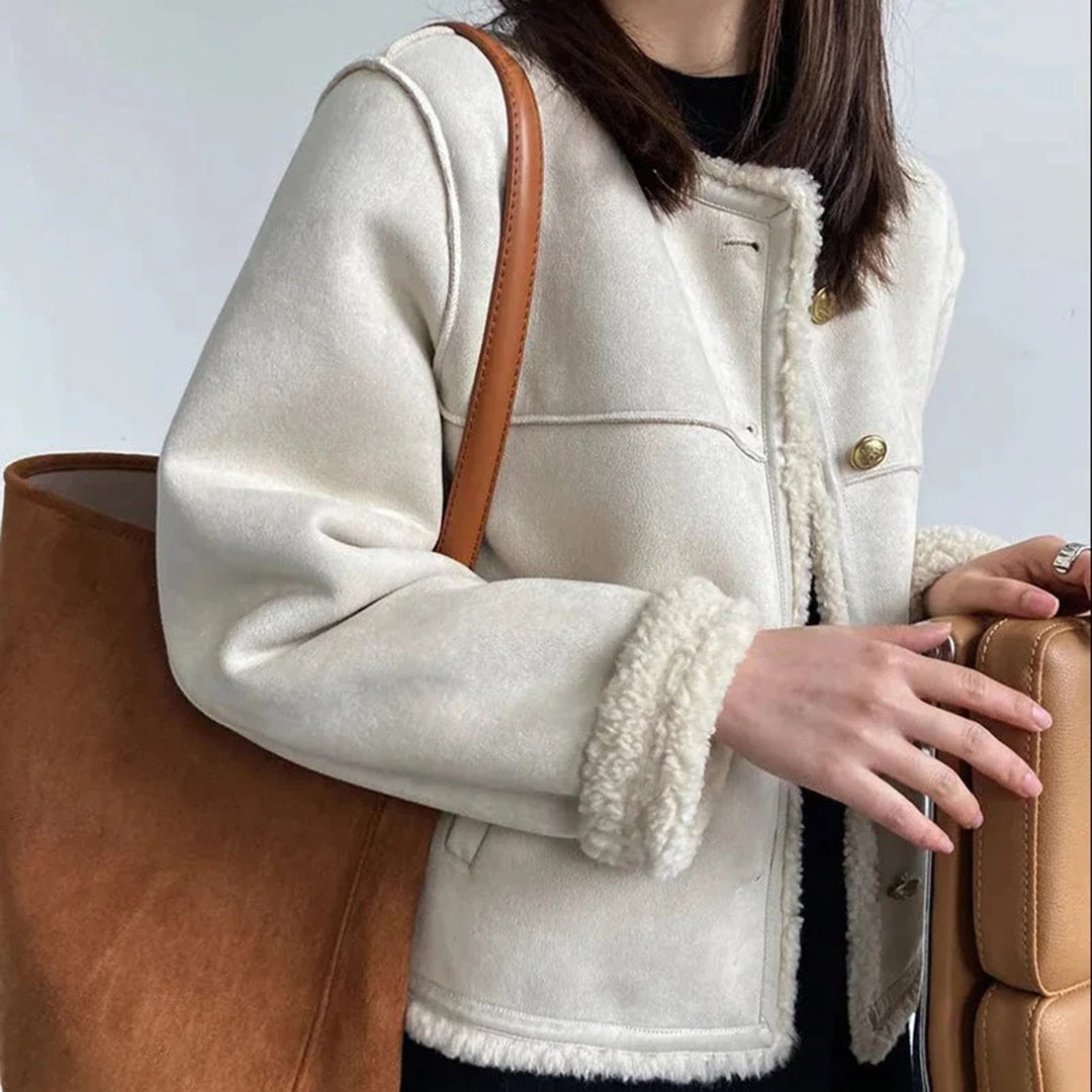 Odette shearling coat in cream, styled with tote bag