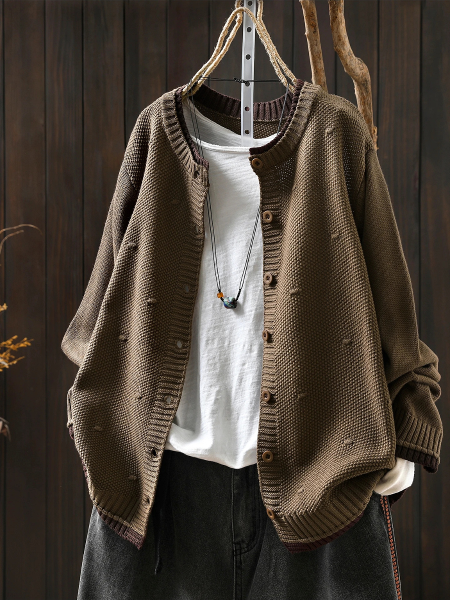 Odette oversized sand color knit cardigan, front view on hanger