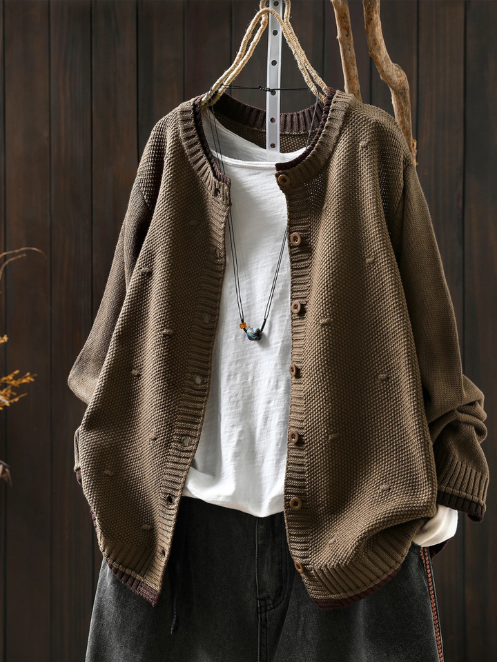 Odette oversized sand color knit cardigan, front view on hanger