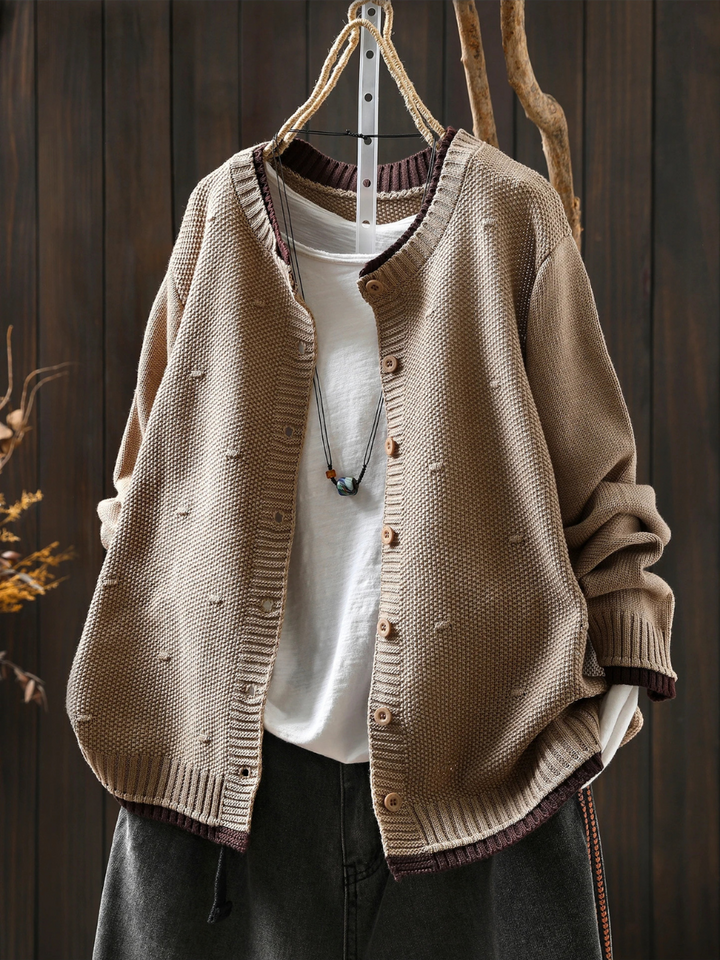 Odette oversized beige knit cardigan, front view styled with denim