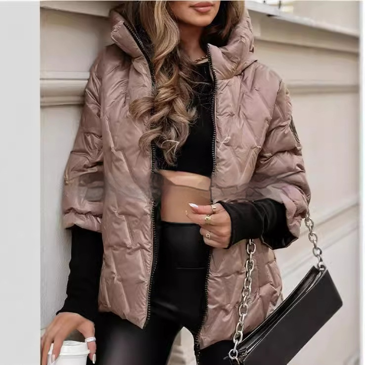 Odette quilted puffer jacket close-up, styled with black leggings