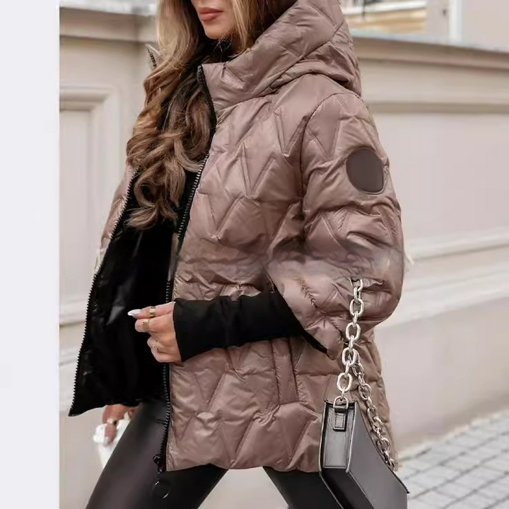 Odette puffer jacket side view showing quilted patchwork texture