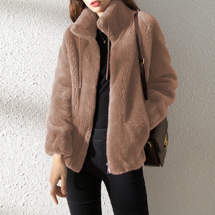 Odette taupe teddy coat with front zip, worn open over black outfit