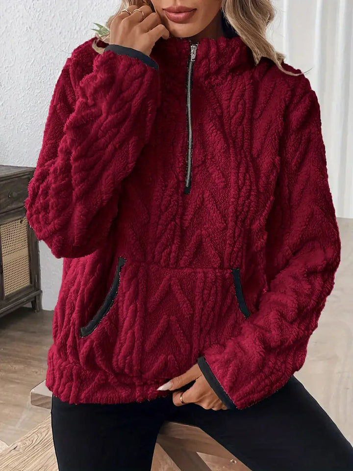 Paloma quarter-zip cable knit sherpa pullover in dark red, close-up of collar and zipper
