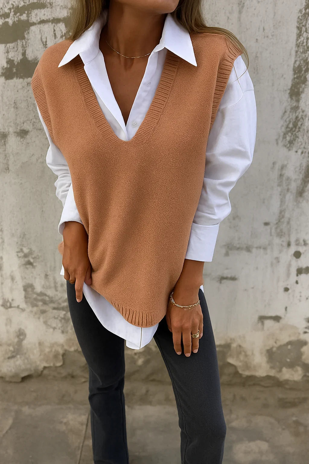 Priscilla brown V-neck sleeveless knit sweater vest layered over white shirt, front view