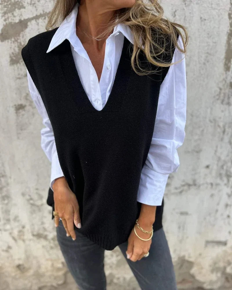 Priscilla black V-neck sleeveless knit sweater vest layered over white shirt