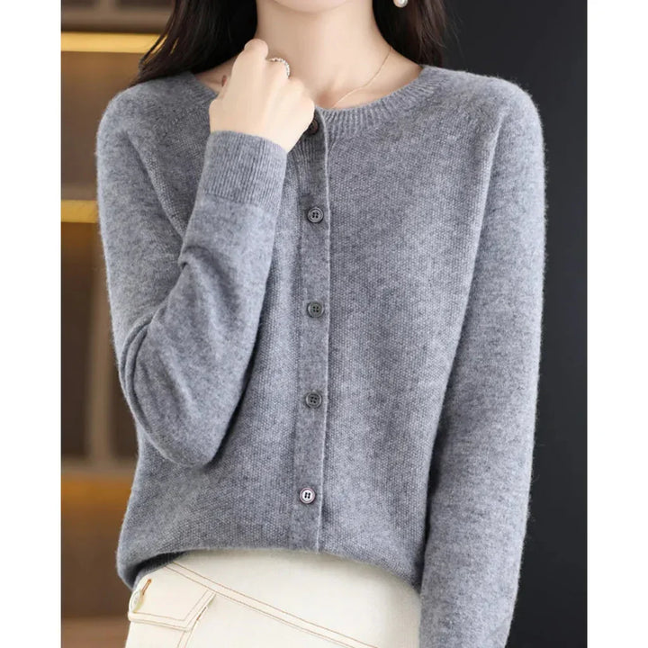 Rosalind button down cardigan in gray, front view with hand at collar
