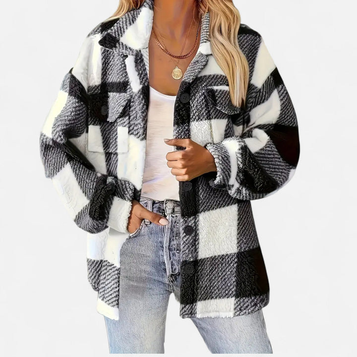 Rosalind black and white checkered plush jacket, front view with hand at collar