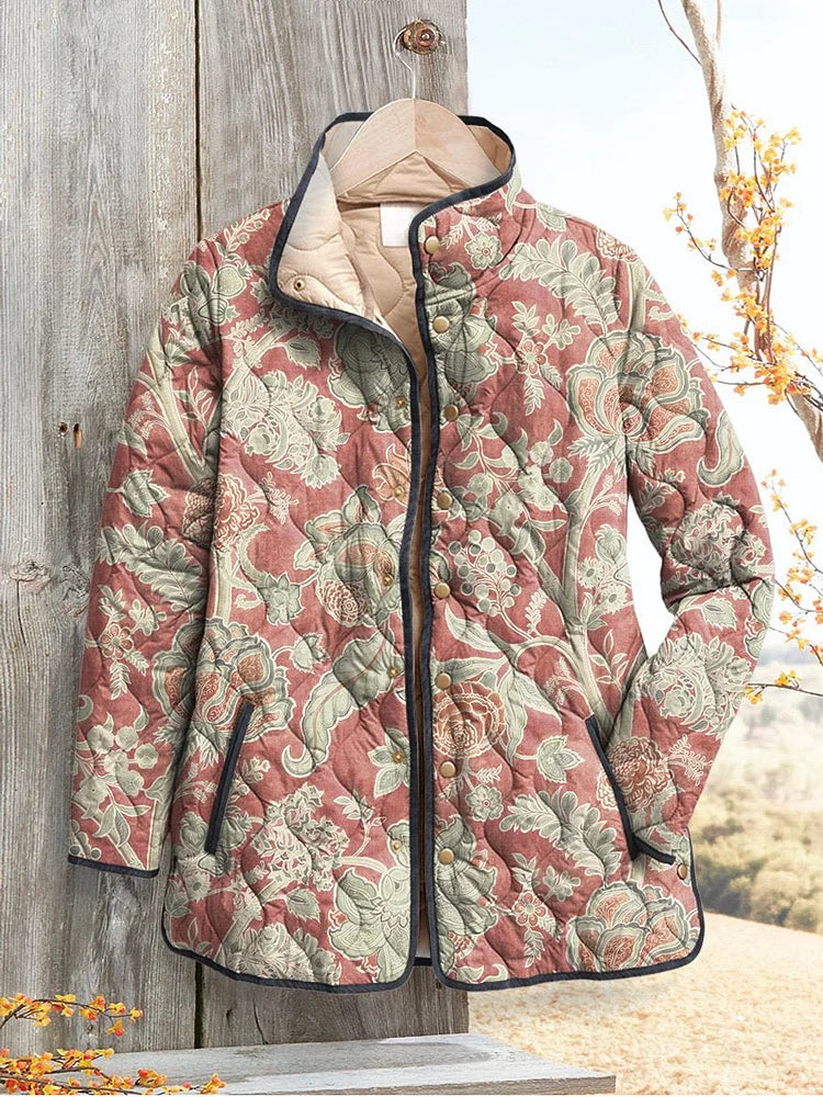 Rosalind floral print quilted jacket hanging on wooden door, front view