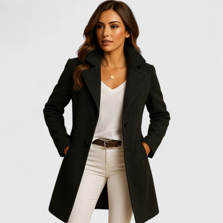 Rosalind notched lapel longline wool coat in black, front view with hands in pockets