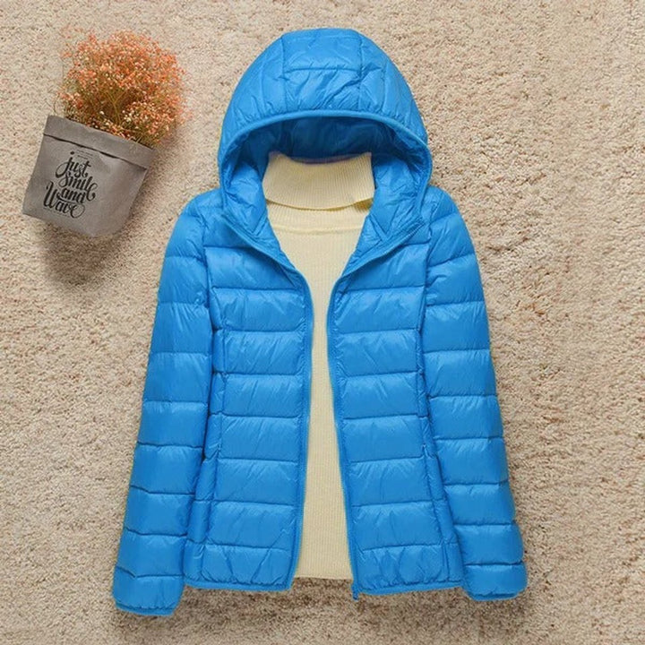Sabina hooded packable puffer jacket in light blue, front view unzipped
