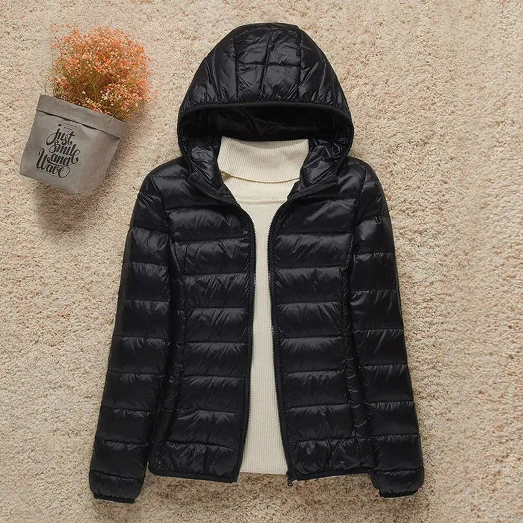 Sabina hooded packable puffer jacket in black, front view with glossy finish