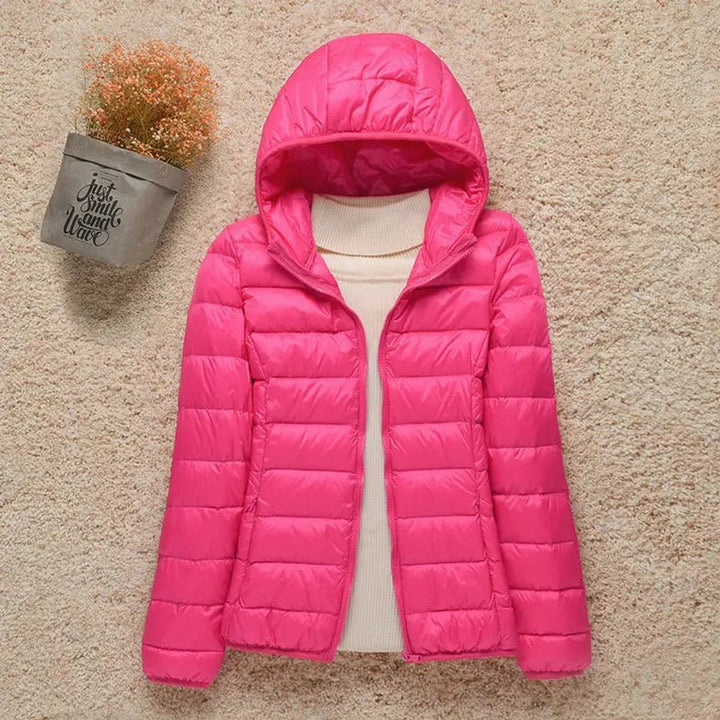 Sabina hooded packable puffer jacket in fuchsia, front view with hood up