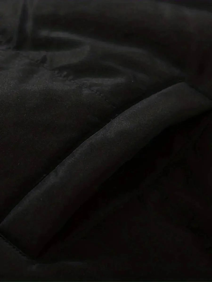Close-up of quilted side pocket detail on Sabine puffer jacket