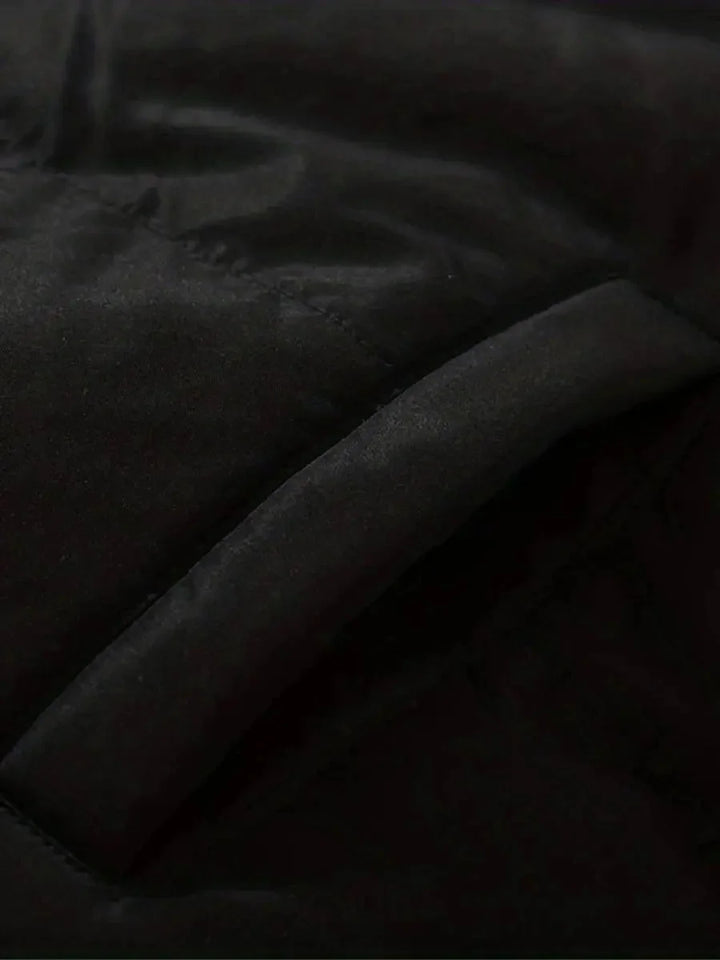 Close-up of quilted side pocket detail on Sabine puffer jacket