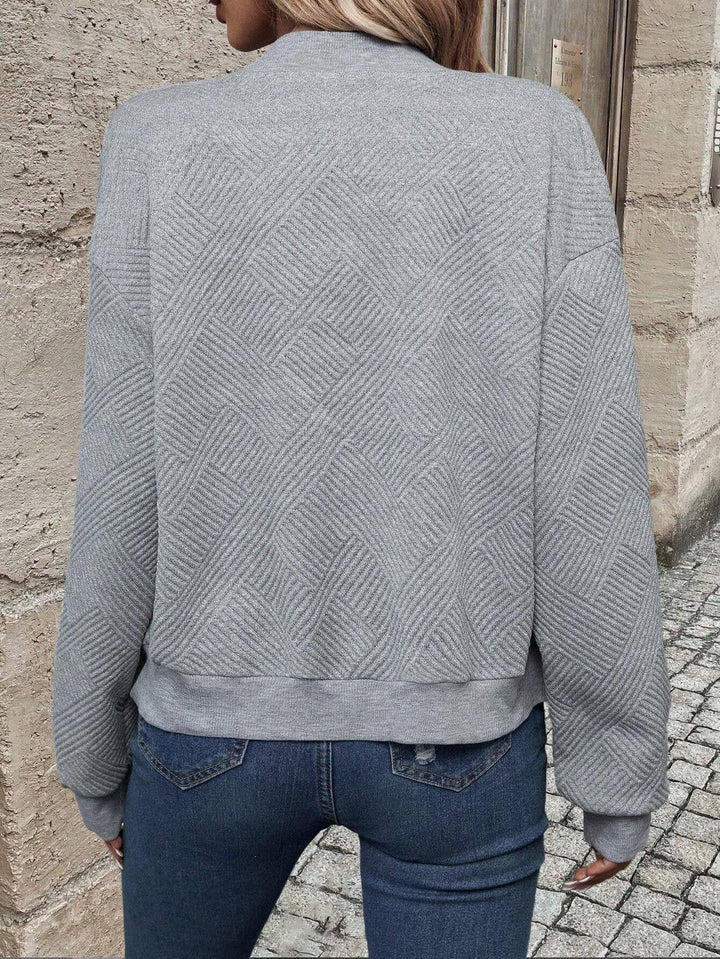 Sabine gray textured bomber jacket, back view showing diagonal stripe pattern