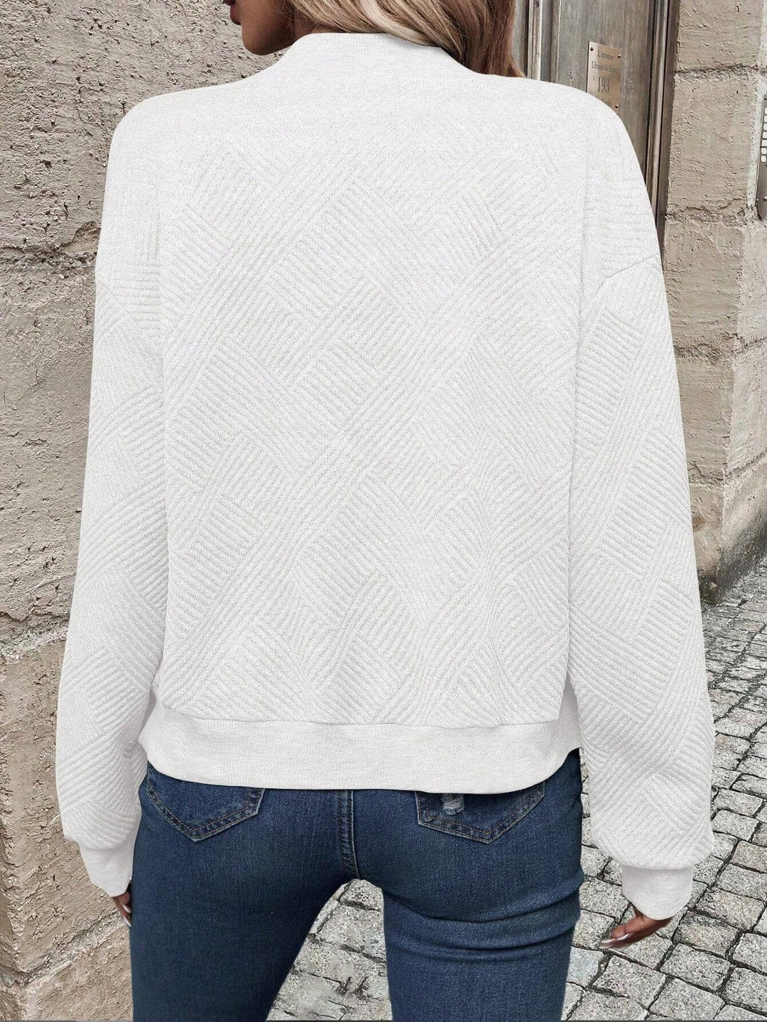 Sabine white textured bomber jacket, back view showing knit texture